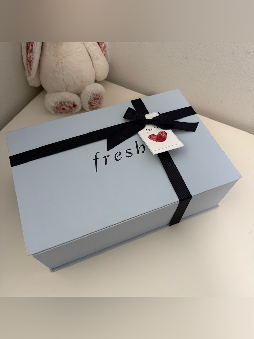 Fresh Blue Gift Box with Black Ribbon and Tag